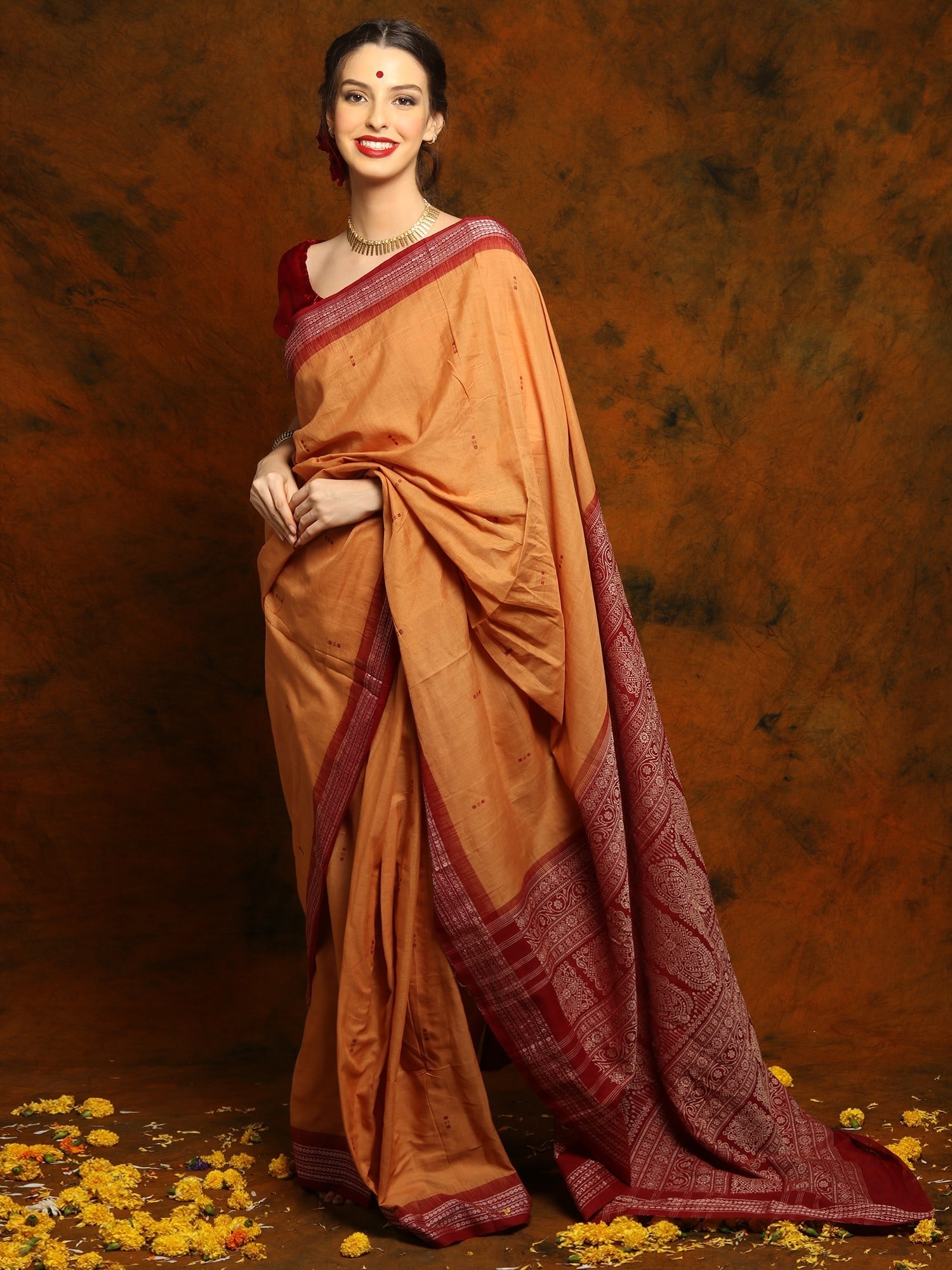 Tangerine Cotton Bomkai Saree with Maroon Palla and Traditional Motifs: Title:Tangerine Cotton Bomkai Saree with Maroon Palla and Traditional Motifs Description:The Tangerine Cotton Bomkai Saree with a striking Maroon Palla effortlessly merges vibrant hues with