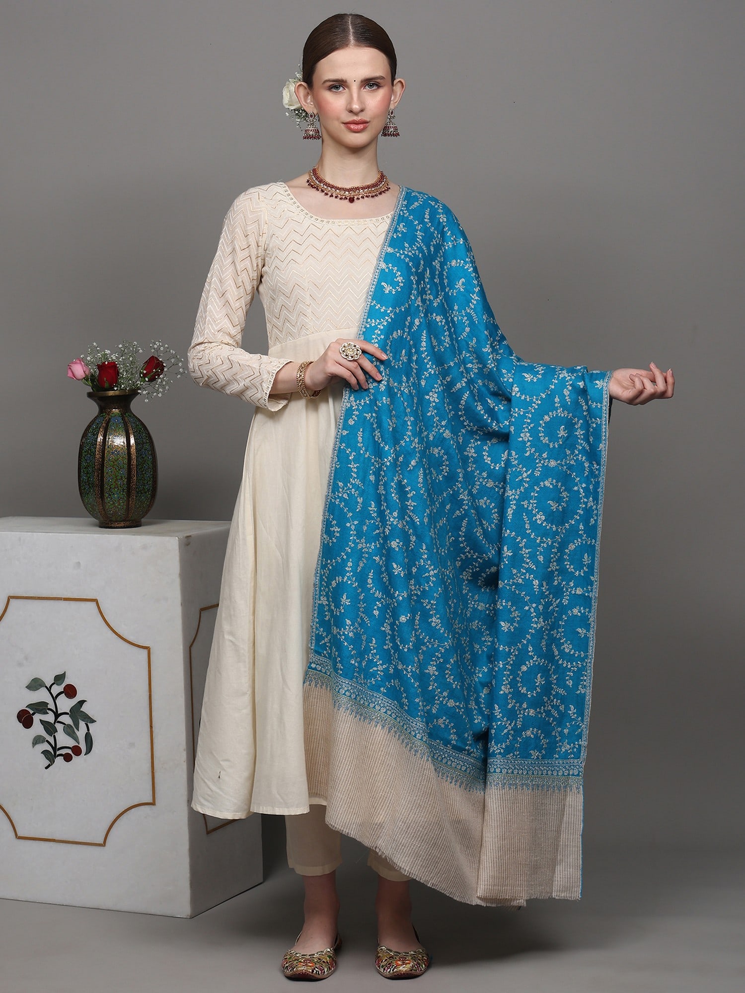 Horizon-Blue Jaldaar Sozni Embroidered Pure Pashmina Shawl with Stripe Border: Title:Horizon-Blue Jaldaar Sozni Embroidered Pure Pashmina Shawl with Stripe Border Description:Kashmir, the heaven on earth, has produced many exquisite art forms. The origin of Pashmina is also attr