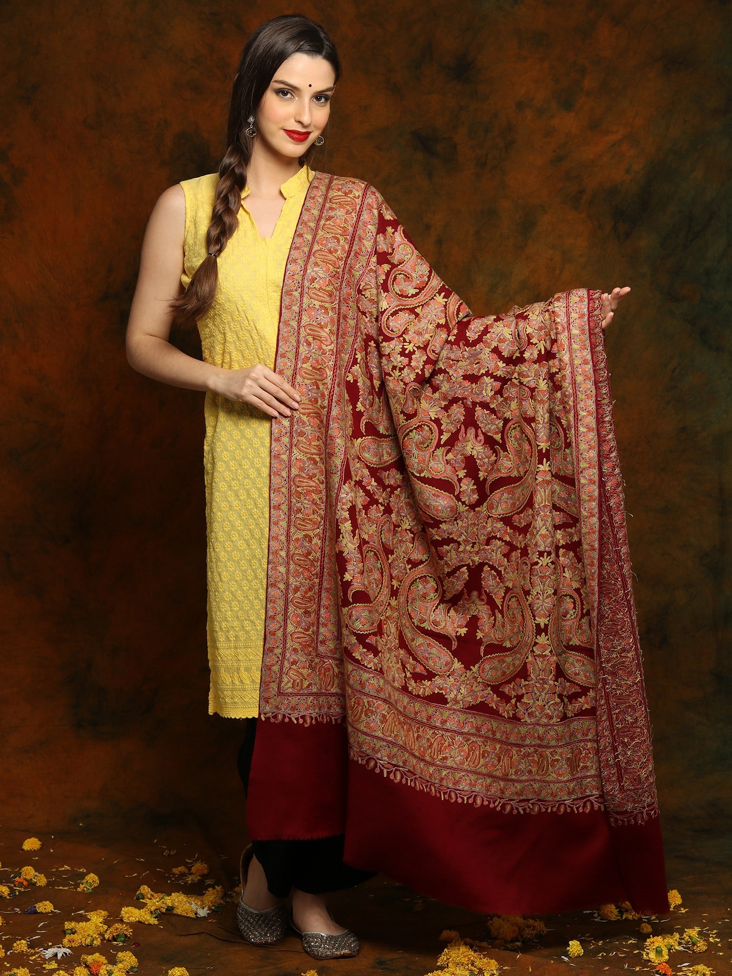 Maroon Pashmina Shawl with Heavily Detailed Floral Aari Embroidery: Title:Maroon Pashmina Shawl with Heavily Detailed Floral Aari Embroidery Description:Embrace the extravagance of this Maroon Pashmina Shawl, an exemplar of elegance. The exquisite maroon-colored body