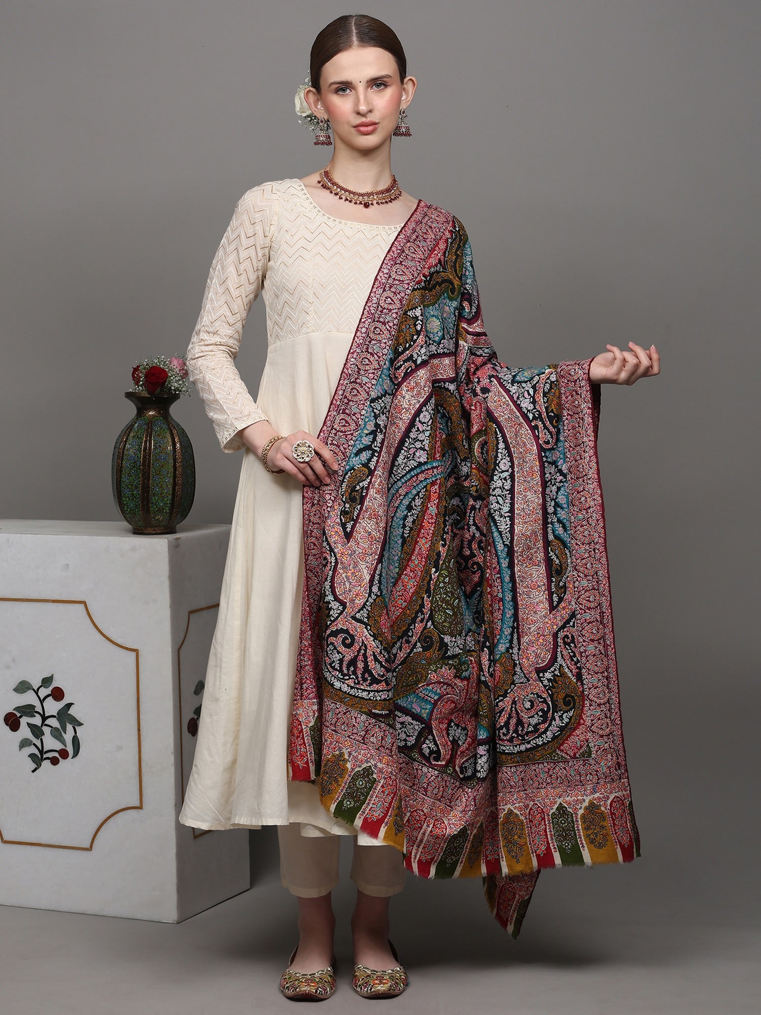 Pure Pashmina Shawl with Multicolor Thread Sozni Embroidered Paisleys and Floral Leaves: Title:Pure Pashmina Shawl with Multicolor Thread Sozni Embroidered Paisleys and Floral Leaves Description:Drape yourself in elegance with our Multicolored Boti Work Pashmina Shawl, a masterpiece of he