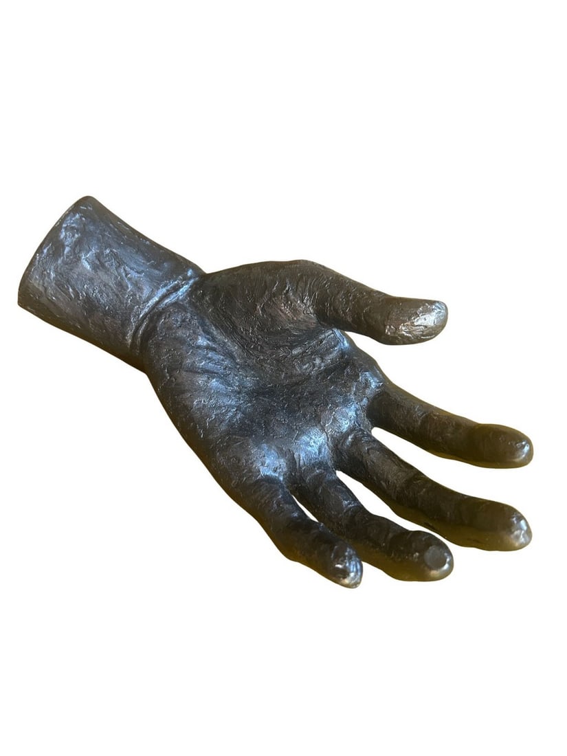 Patinated Hand Sculpture (Resin Cast): A modern artistic depiction of a human hand, crafted in patinated resin. The sculpture presents a textured, organic surface, highlighting the unique tactile quality of the material. The hand is
