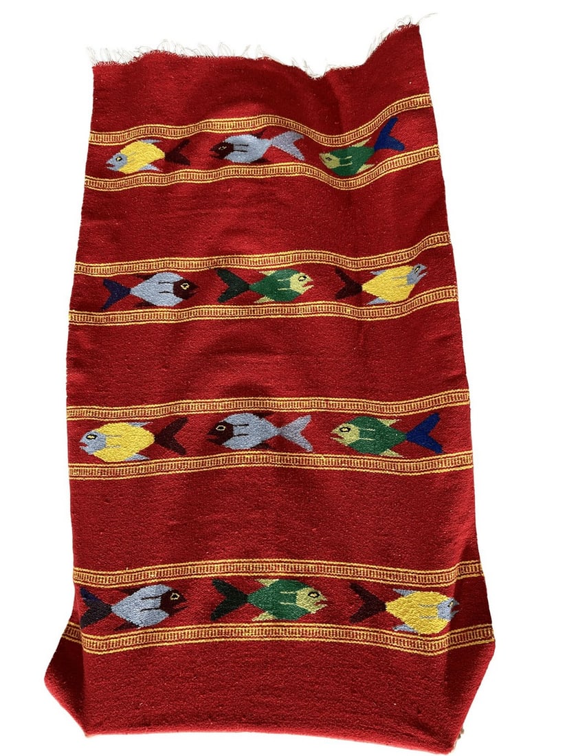 Hand-Woven Red Textile with Fish Motif: This vibrant hand-woven textile features a striking red ground adorned with horizontal bands of colorful fish. The fish motifs, rendered in shades of yellow, light blue, and green with darker accents,