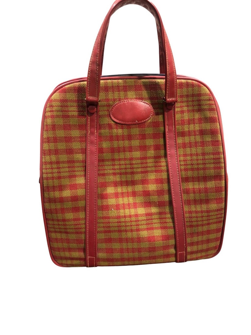 Vintage Lark Red and Gold Plaid Travel Bag: This vintage travel bag by Lark features a striking red and gold plaid pattern on a woven textile, accented with red faux leather trim and handles. The bag has a top zipper closure with a brass-toned