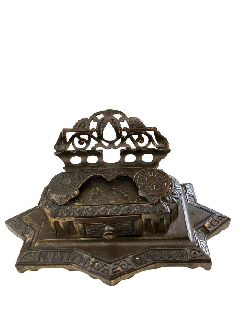 Bradley & Hubbard double inkwell with pen rest and small drawer: Gilt cast iron double inkwell. Bradley & Hubbard Mfg Co. triangle stamp on the bottom as well as model number 6062. Late 19th century. Original, patina surface. Thereâ€™s a small
