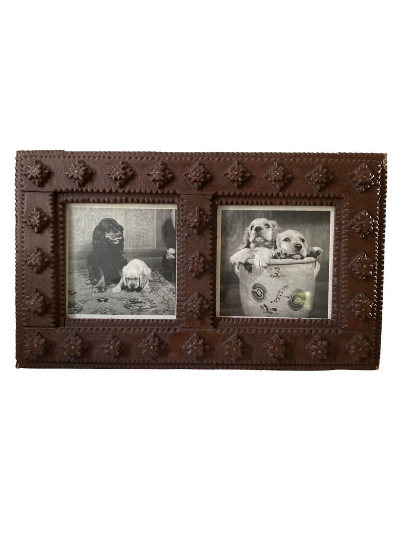 Tramp art double opening frame: Overall size: 10" wide x 6" tall. Each opening is 3.5" c 3.5". Vintage photographs of two dogs, possibly cocker spaniels, in each opening. Brass brads in center of each starlike embellishment. Minor
