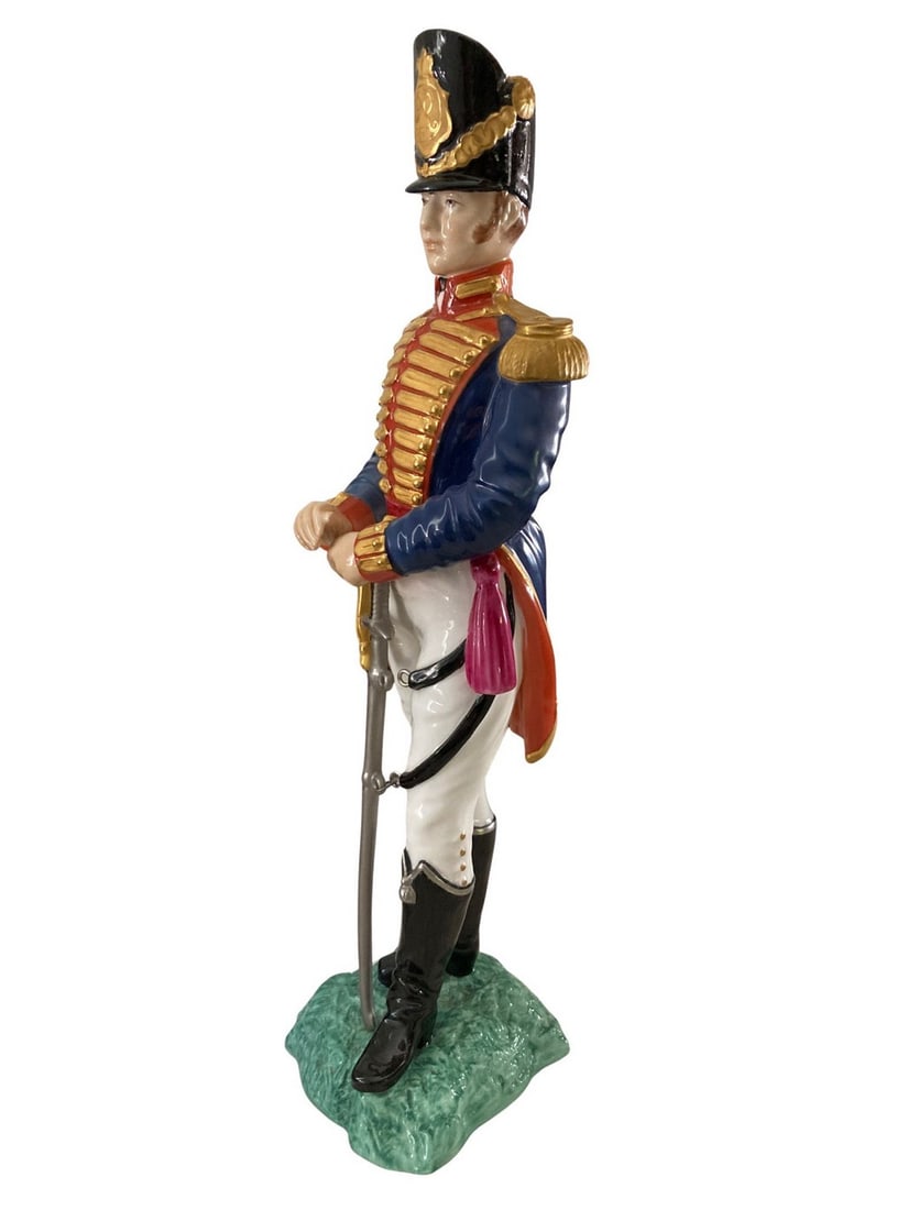 Royal Worcester "Officer of the Royal Artillery" figurine, c. 1960s-1970s: Stamped on bottom: Officer of the Royal Artillery; 1815; Royal Worcester logo; Made in England; 2658. Bone china plume at top of hat is broken off. Small spot of roughness in paint on back of the