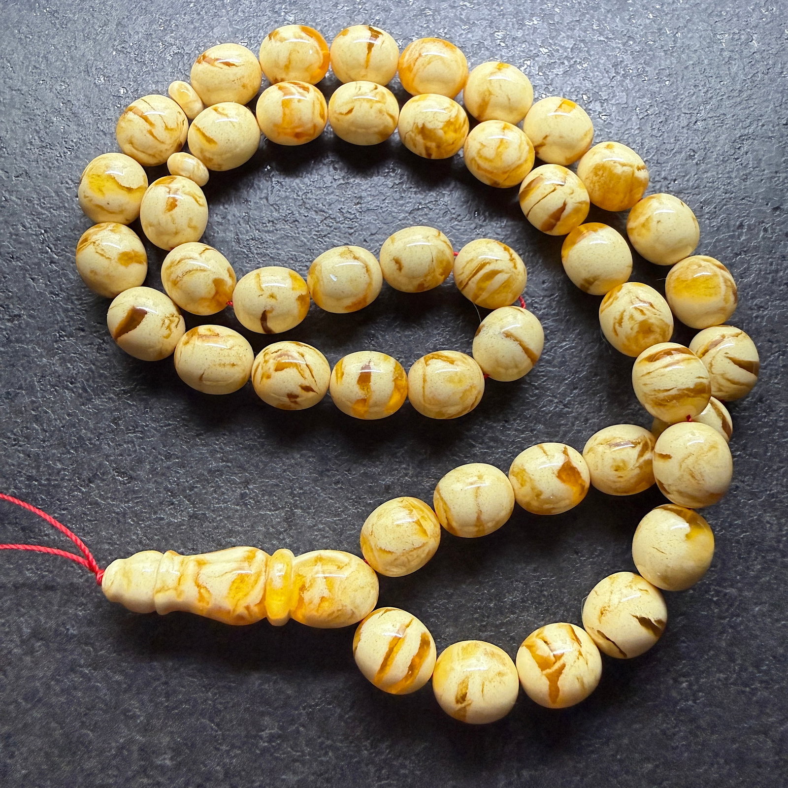 Extraordinary Amber Tesbih made from Round Amber beads: Title: Extraordinary Amber Tesbih made from Round Amber beads Metal: None Gemstone: Reconstituted Amber Weight: 56.84 g Size: 13x12 mm Made of: (Reconstituted Amber or Whole Stone): Reconstituted Ambe