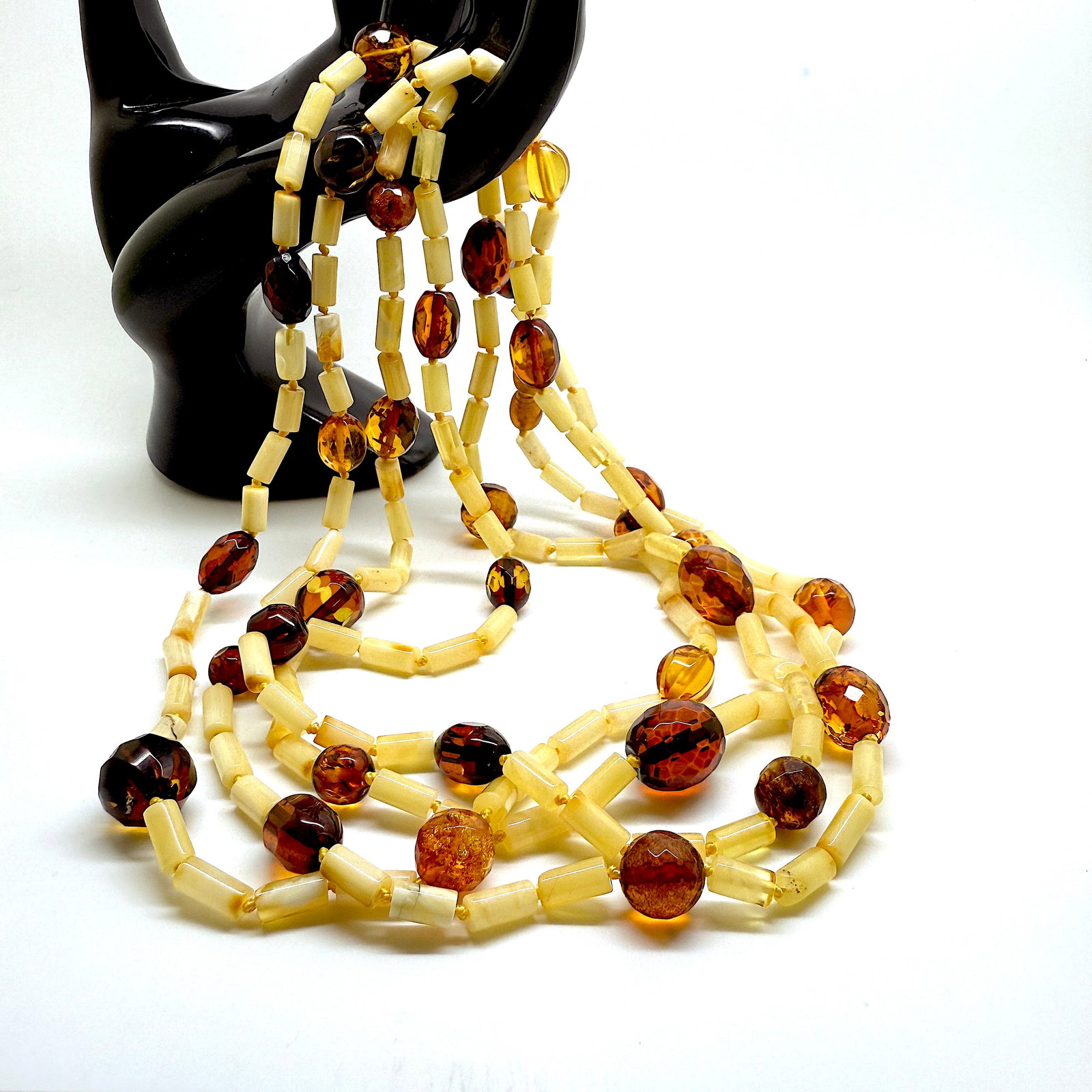 Beautiful Vintage Amber Necklace made from Hand Carved Amber beads: Title: Beautiful Vintage Amber Necklace made from Hand Carved Amber beads Metal: None Gemstone: Whole Stone Weight: 41.5 g Size: 132cm Made of: (Reconstituted Amber or Whole Stone): Natural Amber