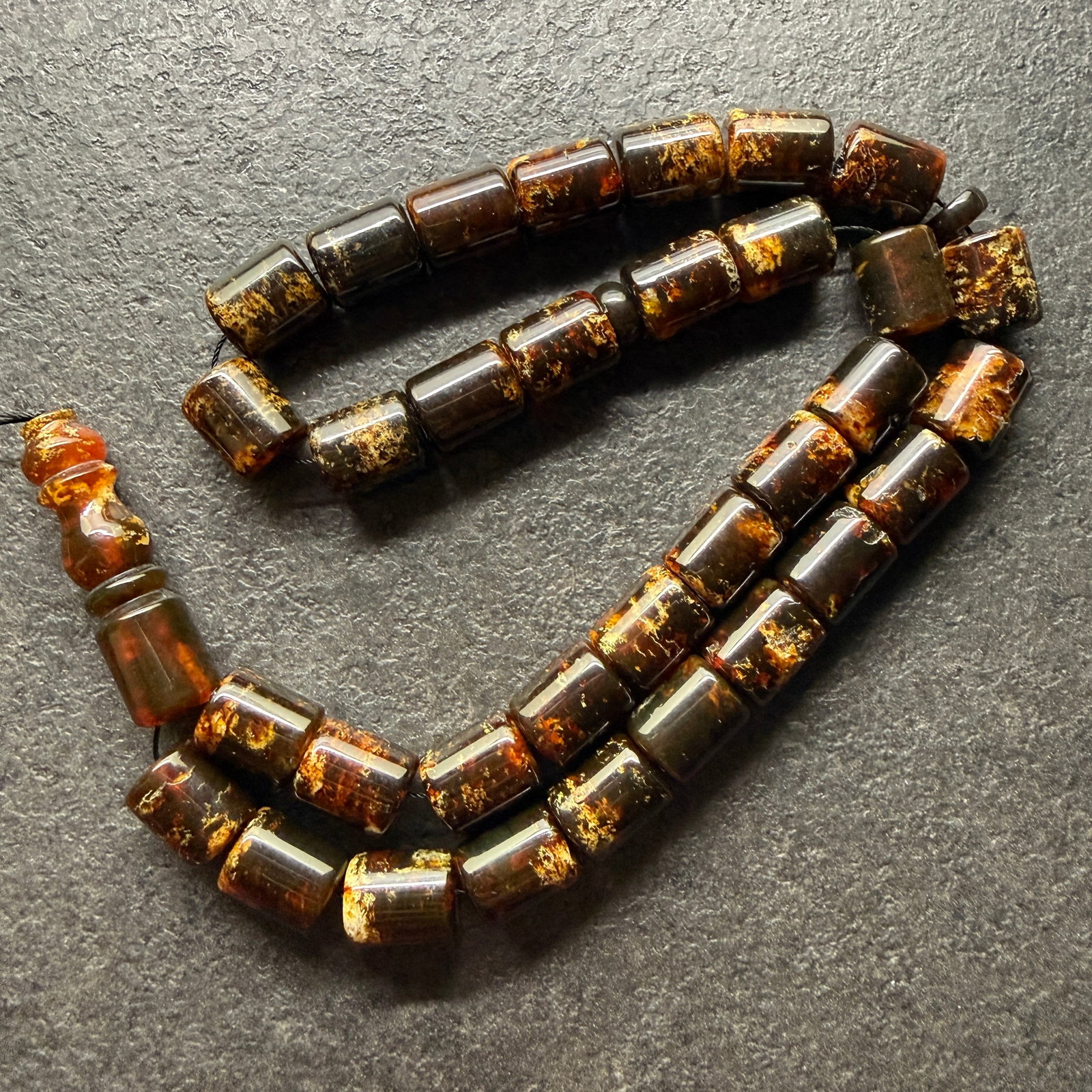 Staggering Amber Tesbih made from Round Amber beads: Title: Staggering Amber Tesbih made from Round Amber beads Metal: None Gemstone: Reconstituted Amber Weight: 36.86 g Size: 12x10 mm Made of: (Reconstituted Amber or Whole Stone): Reconstituted Amber