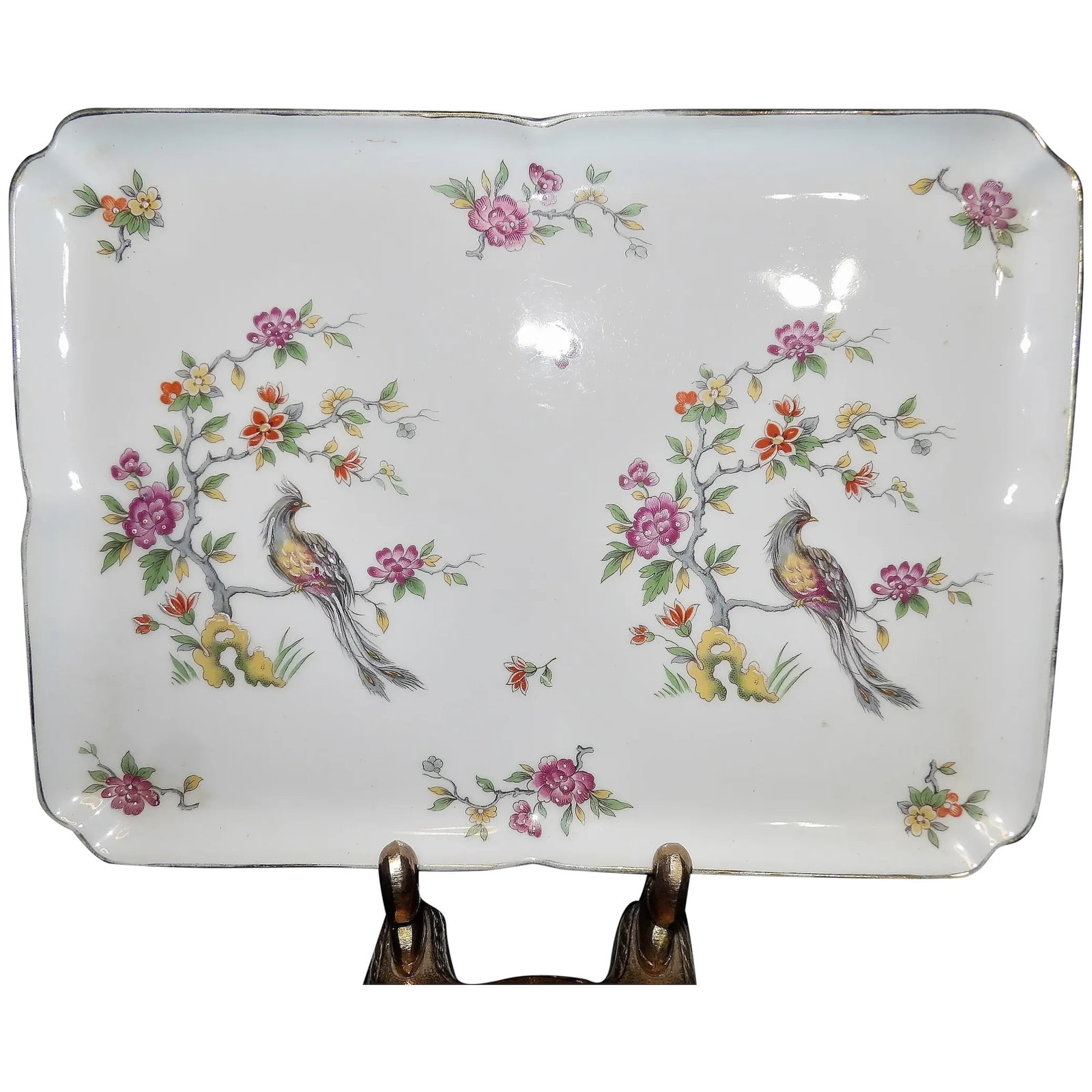 Vintage Limoges Hand Painted 11 1/2" Dresser Tray: This Vintage Limoges Hand Painted 11 1/2" Dresser Tray has no cracks, chips or flea bites. The hand painting is raised in many parts. The gold around the edge shows use and is rubbed off in places- se