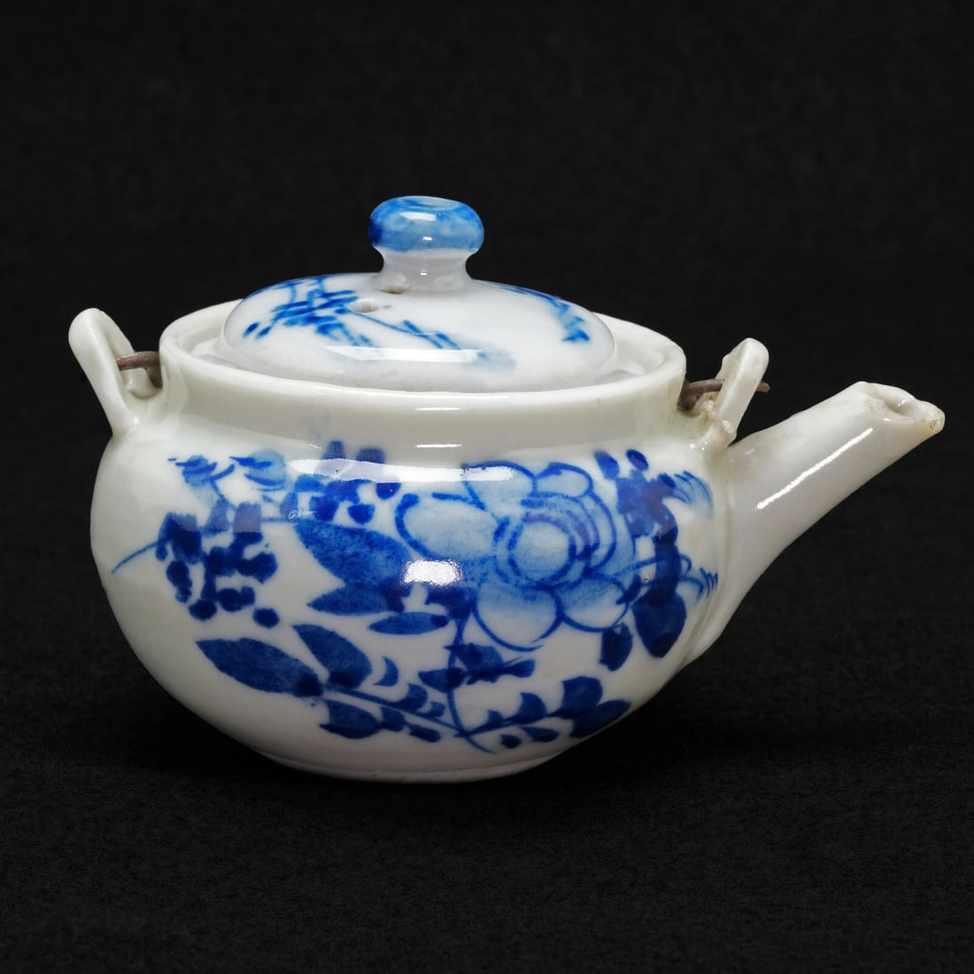 Miniature Japanese Porcelain Teapot with Bird Design Early 20th Century: Title:Miniature Japanese Porcelain Teapot with Bird Design Early 20th Century Size:3 1/2 in (8.9 cm) long x 2 1/2 in (6.4 cm) wide x 2 1/4 in (5.7 cm) tall (without handle). Description:A fun,