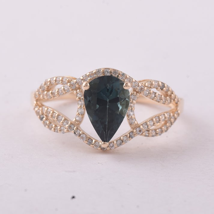 1.35 Ct Pear Tourmaline 9K Gold Ring: 1.35 Total Carat Tourmaline 9K Gold Ring Specifications: Total Weight 2.28 g Center Gemstone Tourmaline Gemstone Carat Weight 1.12 Carats Gemstone Measurements 9X6 mm Additional Gemstones White Sapphi