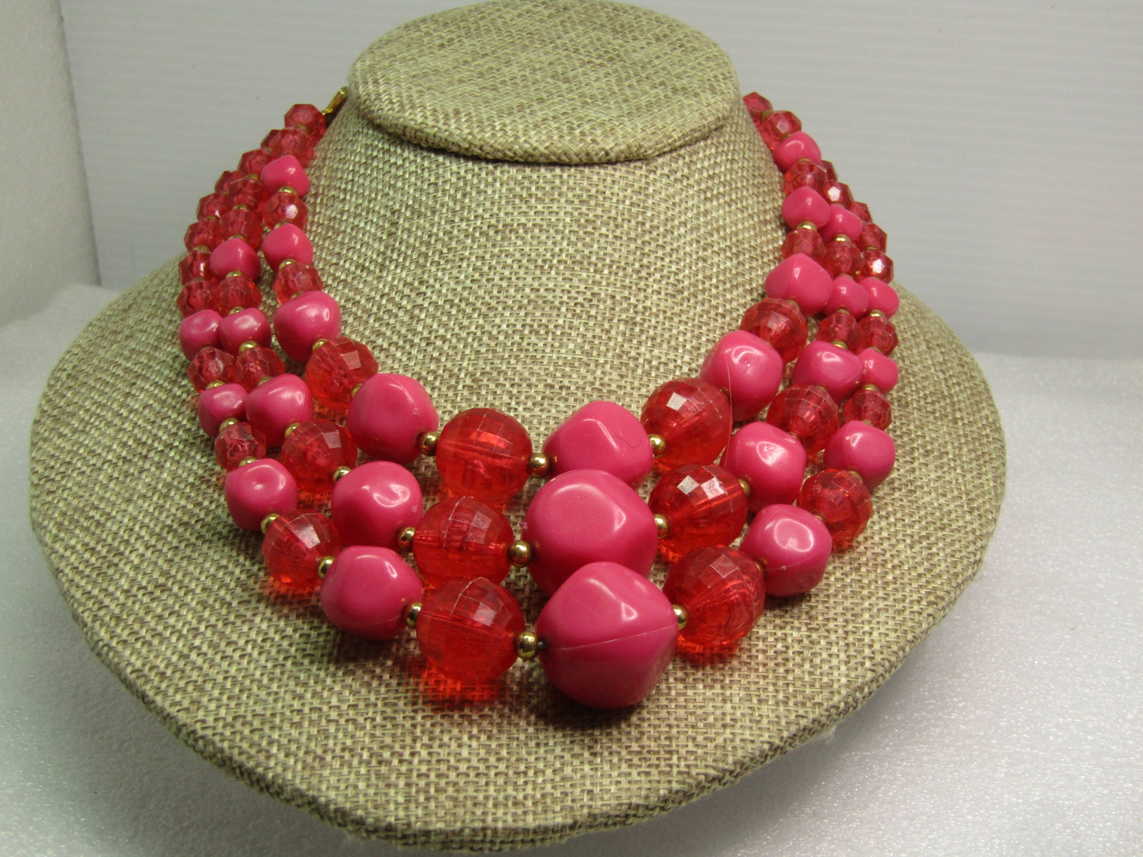 Vintage Pink Graduated Triple Strand Necklace, 16", 1950's-1960's: Title: Vintage Pink Graduated Triple Strand Necklace, 16", 1950's-1960's Description: Vintage Pink Graduated Triple Strand Necklace, 1950's-1960's . Pink lucite in a faceted clear bead that is appx. 7