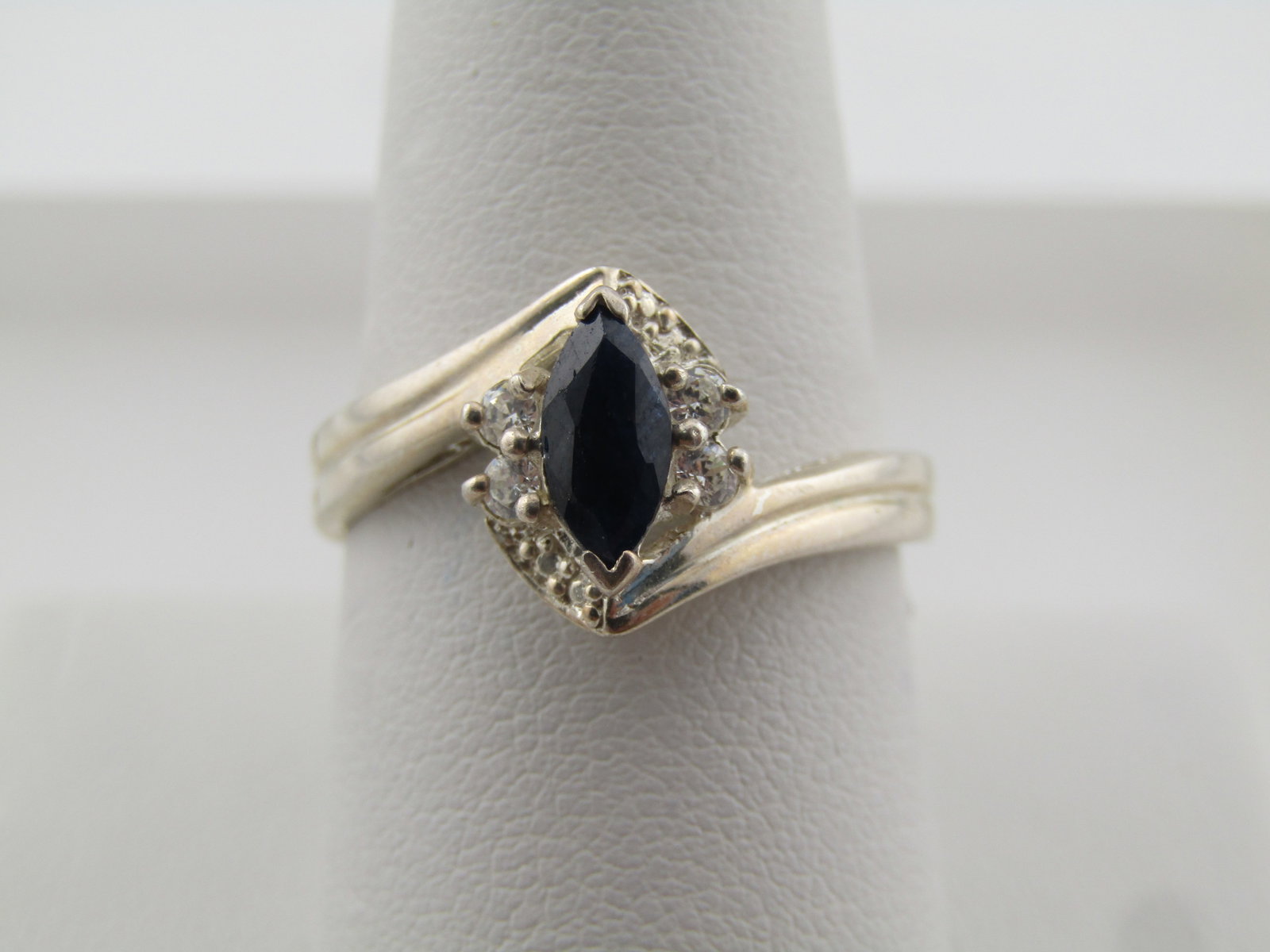Sterling Lab Sapphire CZ Ring, Sz. 9.5, Bypass, 1990's: Title: Sterling Lab Sapphire CZ Ring, Sz. 9.5, Bypass, 1990's Description: Sterling Lab Sapphire CZ Ring, Sz. 9.5, Bypass, 1990's. This has an appx. 3.4mm wide bypass band on top that looks like two