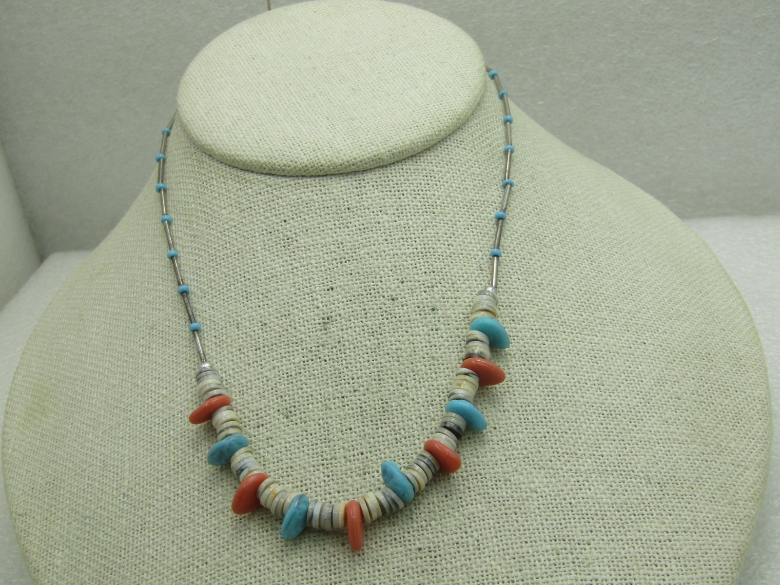Vintage Southwestern Puka and Faux Coral Turquoise Necklace, 14": Title: Vintage Southwestern Puka and Faux Coral Turquoise Necklace, 14" Description: Vintage Puka, Faux Turquoise and Coral Necklace with silver straw beads and small faux turquoise round spacer beads