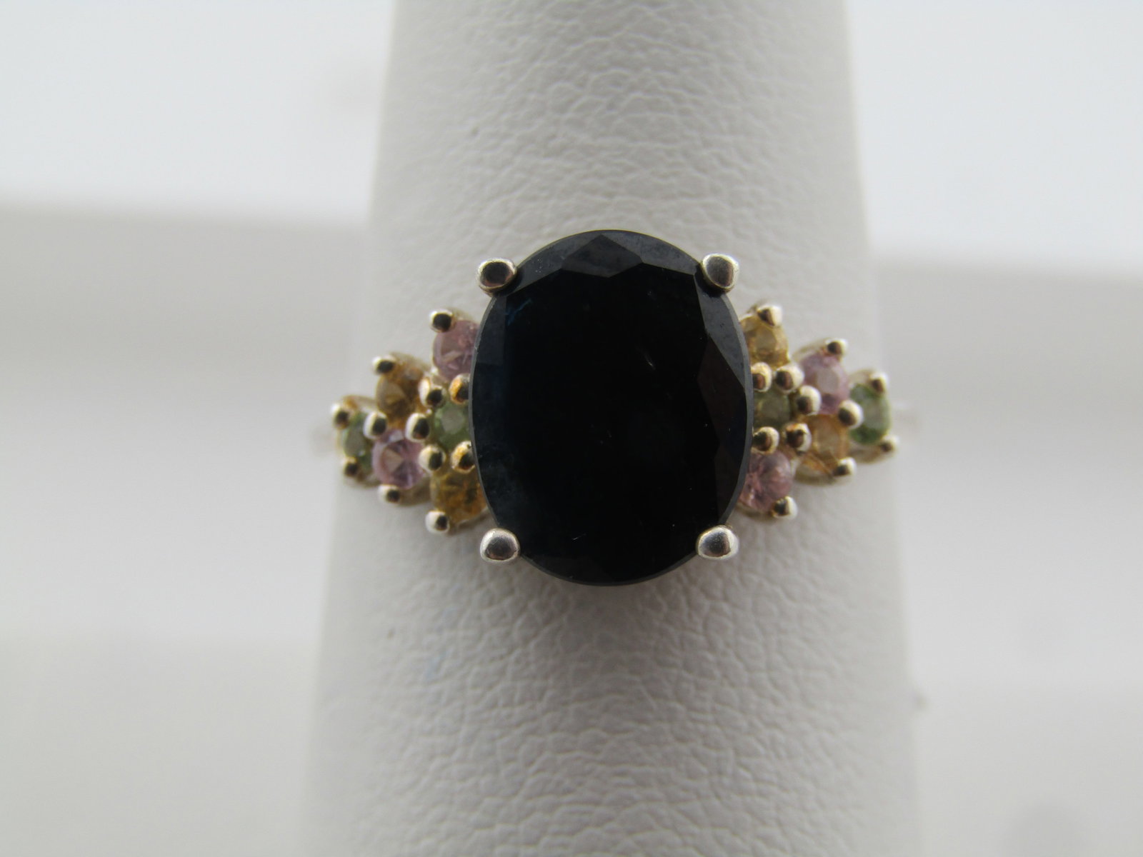 Sterling Blue and Mixed Sapphire Ring, Sz. 8.5, Signed GSJ, 2000's: Title: Sterling Blue and Mixed Sapphire Ring, Sz. 8.5, Signed GSJ, 2000's Description: Sterling Blue and Mixed Sapphire Ring, Sz. 8.5, Signed GSJ, 2000's. The dark blue sapphire is appx. 10mm by 8mm