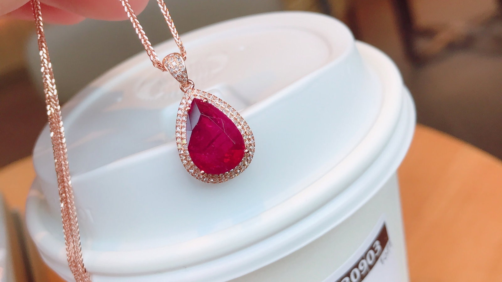 18K Gold Natural Tourmaline Pendant: Title: 18K Gold Natural Tourmaline Pendant Description: This pendant is crafted in 18K gold with a natural tourmaline that is crystal clear. The design is simple yet elegant, complemented by 94 diamon