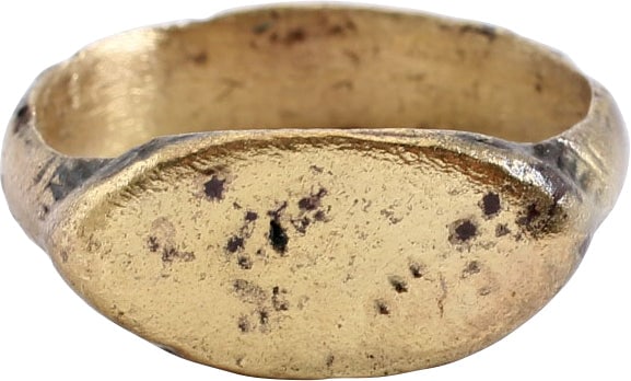 ROMAN SIGNET RING, 1ST CENT BC-2ND CENT AD, SIZE 7 1/2+: Gilt bronze, a little over size 7 1/2 with lenticular bezel with punched lineal motif. 4.8mm rounded band swelled at the bottom and transitioning to ridged reeded shoulders. Professionally