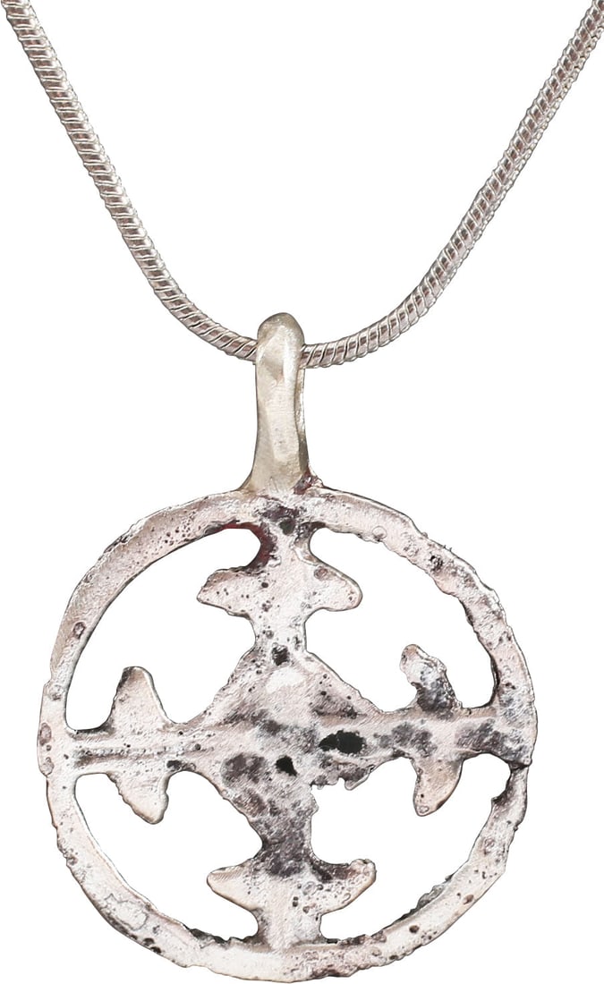 CRUSADER'S CROSS PENDANT NECKLACE, 11TH-13TH CENTURY: 1096-1291. An actual pendant is worn by a crusader nearly 1000 years ago! Circular, pierced with a cross potent, with “crutches" at the beam ends. That form is also known as the Crusader's cross, ha