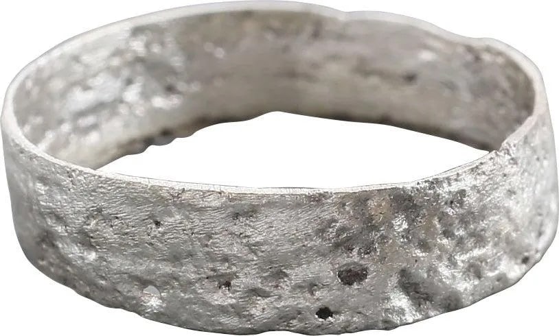 ANCIENT VIKING WEDDING RING 8TH CENTURY AD, SZ 8 1/2: Size 8 1/2, 2.2mm width with flat face. Rare early variation. Cast as a solid disk with a center core to distribute the molten metal and heat. The core was then, laboriously removed by hand with remna