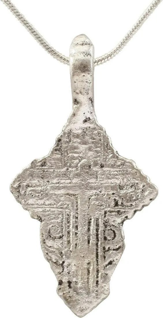 EASTERN EUROPEAN CHRISTIAN CROSS NECKLACE 17th-18t: Silvered bronze, about 1 5/8" total height. Raised border delineating a cross with broad beams, the cross beam above center, and enclosing a stick cross. Reverse with Cyrillic inscriptions. The