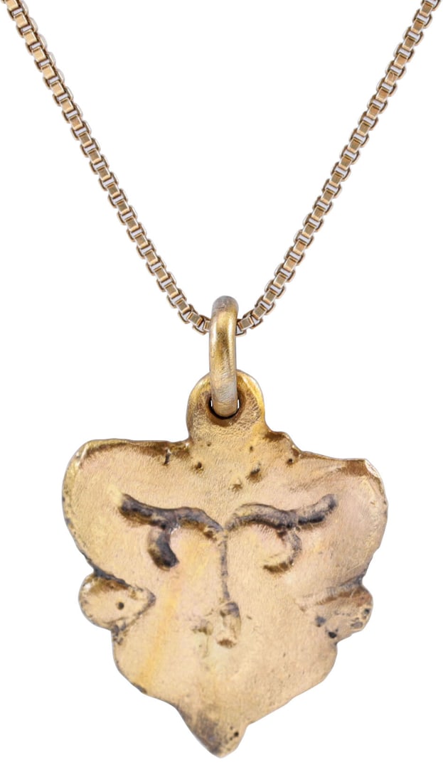 CLASSIC VIKING HEART PENDANT NECKLACE 9th-10th CENTURY AD: Gilt bronze of highly decorative form suggesting that it was made for a Clan Chief. Over 3/4" (0.79") height of cusped form. The sides indented with nubs, which along with the pointed tip, form a