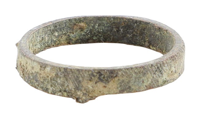 VIKING WOMAN'S WEDDING RING C.850-1050, SIZE 6: Bronze, size 6, 3.2mm rounded face band. Untouched condition as found. Quite crisp with remnants of incised hatched decoration intact with glossy mottled green patina. Jewelry gift boxed with certific