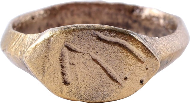ROMAN GILT CHRISTIAN RING C.3RD-7TH CENTURY: Late Empire to the Early medieval period, the period of the growth of Christianity. Size 3 3/4 for the small finger. 3.2mm band. Raised lenticular bezel with curvilinear lines. Partial figures such as