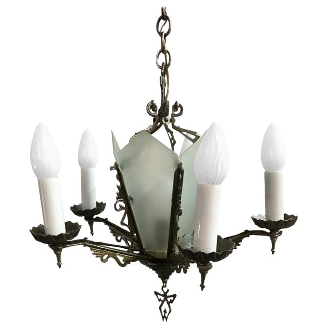Art Deco Slat Glass Chandelier With Geometric Details: Title: Art Deco Slat Glass Chandelier With Geometric Details Description: Five-arm geometric Art Deco chandelier with candle-style lights and a light-up slat glass center. The piece features scrolling