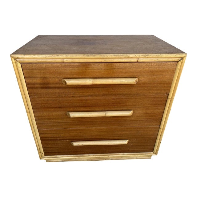 1940s Restored Mahogany Nightstand With Rattan Accents: Title: 1940s Restored Mahogany Nightstand With Rattan Accents Description: Restored mid-century mahogany lowboy dresser with oversized rattan handles. The dresser features a dark stained body and thre