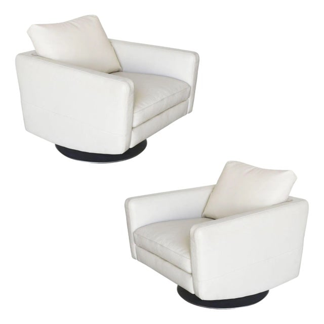 Italian Modern Leather Swivel Lounge Chairs With Steel Base by Natuzzi, Pair: Title: Italian Modern Leather Swivel Lounge Chairs With Steel Base by Natuzzi, Pair Description: Pair of of Italian-made modern white leather swivel lounge chairs, each with a brushed steel base made