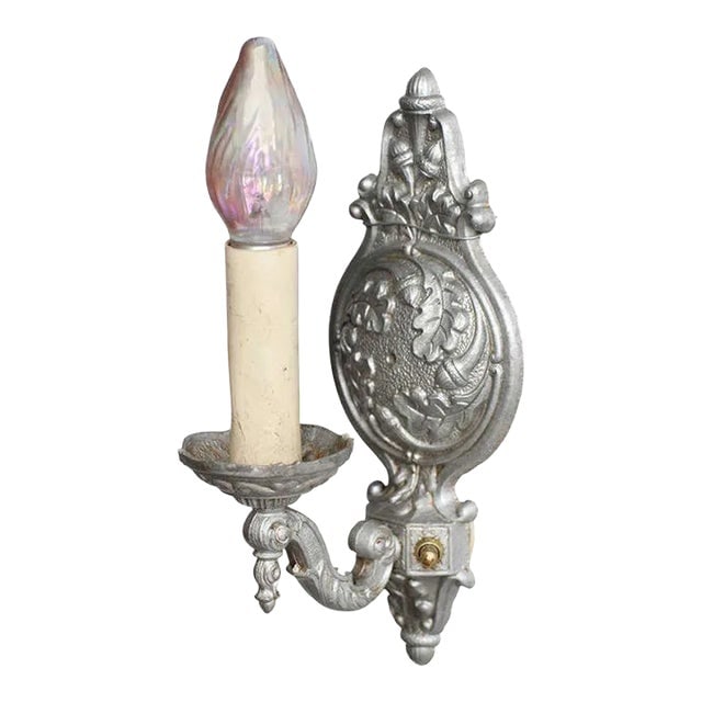 1920s Regency Style Cast Aluminum Wall Sconce by Gold Co, 4 Available: Title: 1920s Regency Style Cast Aluminum Wall Sconce by Gold Co, 4 Available Description: Elegant Regency-style cast aluminum wall sconce featuring intricate floral and leaf designs with a classic sil