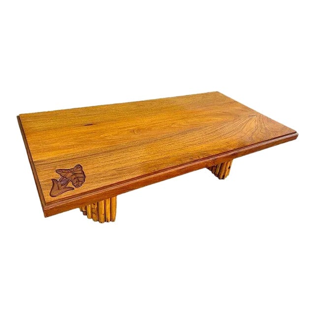 1950s Mid-Century Hand Carved Koa Wood Coffee Table W/ Stacked Rattan Legs: Title: 1950s Mid-Century Hand Carved Koa Wood Coffee Table W/ Stacked Rattan Legs Description: 1950's Koa Wood Coffee Table with Stacked Rattan Legs & Hand Carved Anthurium Motif along the corner. Thi