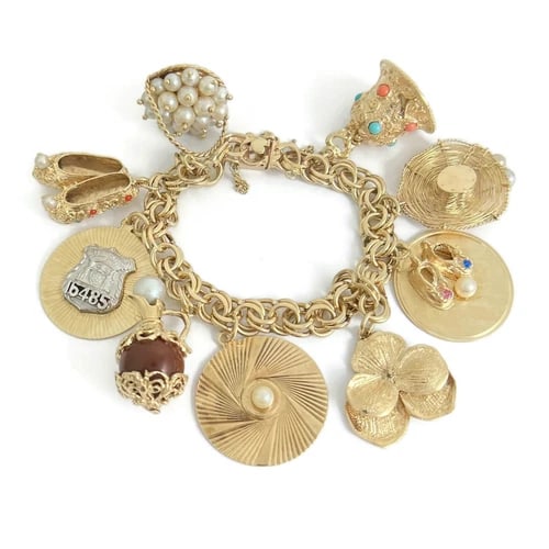 Vintage 1950's Pearl Shoes Hat Police Charm Bracelet 14K Yellow Gold, 59.27 Gram: Vintage 1950's Pearl Shoes Hat Police Charm Bracelet 14K Yellow Gold, 59.27 Gram A truly one-of-a-kind vintage charm bracelet! Please do not hesitate to ask any questions. Circa: 1950's Charms: bell, 
