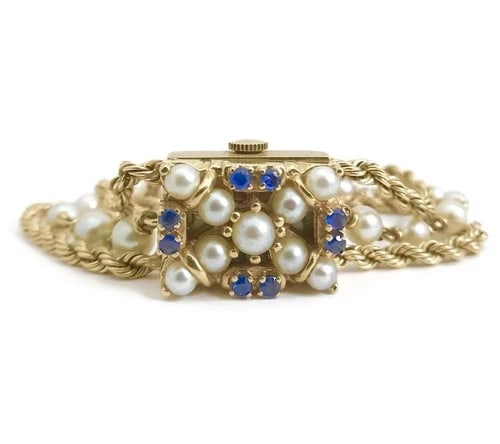 Vintage 1940's Nelmor Pearl Sapphire Bracelet Watch 14K Yellow Gold, 30.7 Grams: Vintage 1940's Nelmor Pearl Sapphire Bracelet Watch 14K Yellow Gold, 30.7 Grams This gorgeous vintage timepiece will add style to any attire. Please let us know if you have any questions. Circa: 1940'