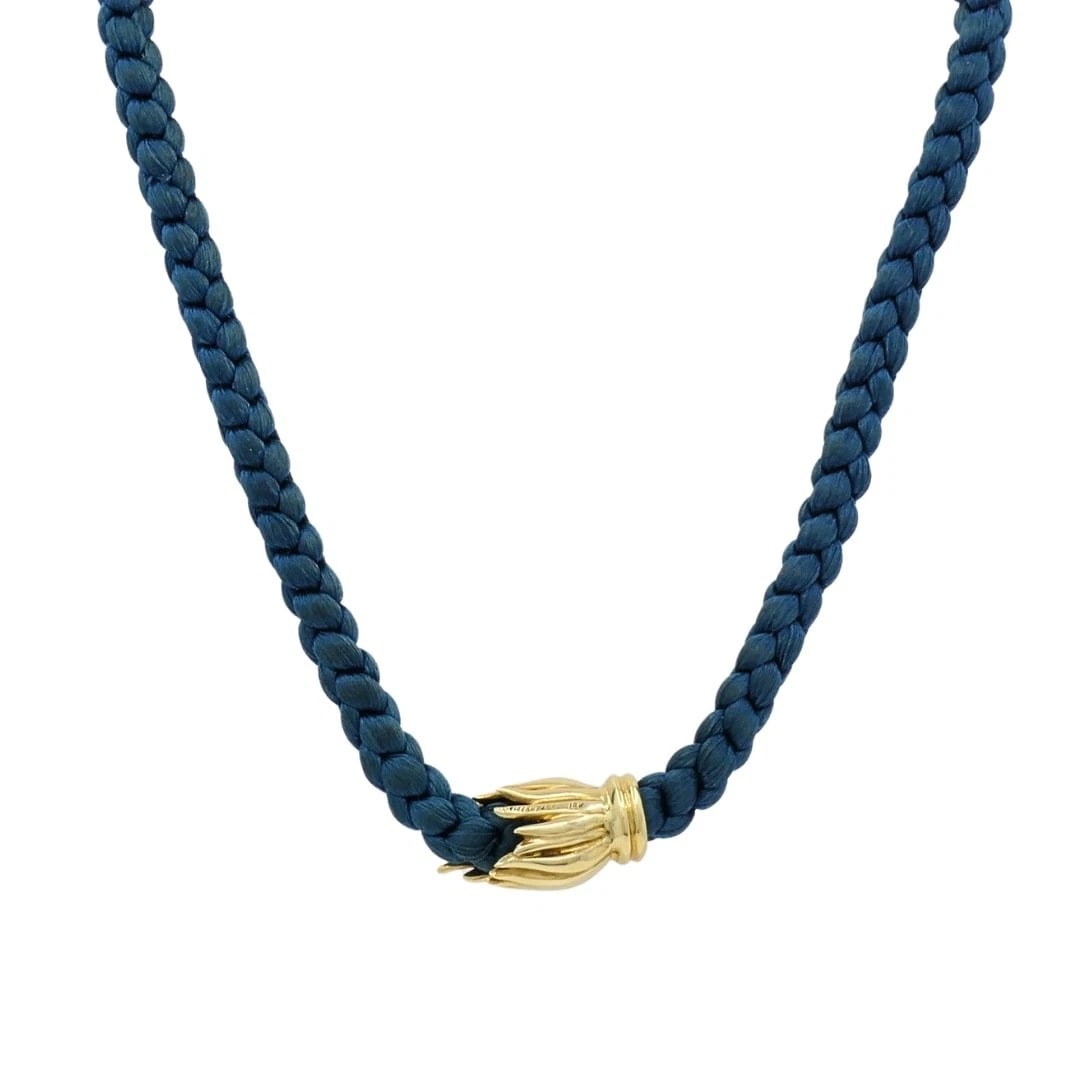 Tiffany & Co. 18k Gold Tulip Clasp Braided Cord Necklace: Title: Tiffany & Co. 18k Gold Tulip Clasp Braided Cord Necklace Description: ES AOOO Product details: DESIGNER: Tiffany & Co. MATERIALS: 18K Gold WEIGHT: 27.3 Grams MEASUREMENTS: Cord - 1/4" x 16" Cla
