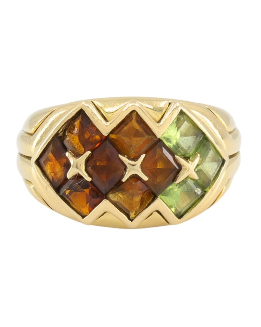 Bvlgari Bulgari Gemstone 18k Gold Cocktail Ring: Title: Bvlgari Bulgari Gemstone 18k Gold Cocktail Ring Description: NS NGTO This Bulgari ring features a geometric arrangement of the gemstones set in 18k yellow gold. The design is built around a