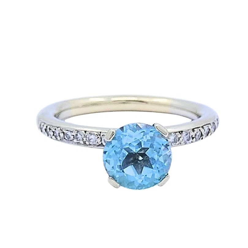 14k Gold Blue Topaz Diamond Accent Ring: Title: 14k Gold Blue Topaz Diamond Accent Ring Description: ES TOO Product details: MATERIALS: 14k Gold GEMSTONE: Topaz, Diamond WEIGHT: 4.1 Grams RING SIZE: 7 ITEM DETAILS: 14k Gold Blue Topaz