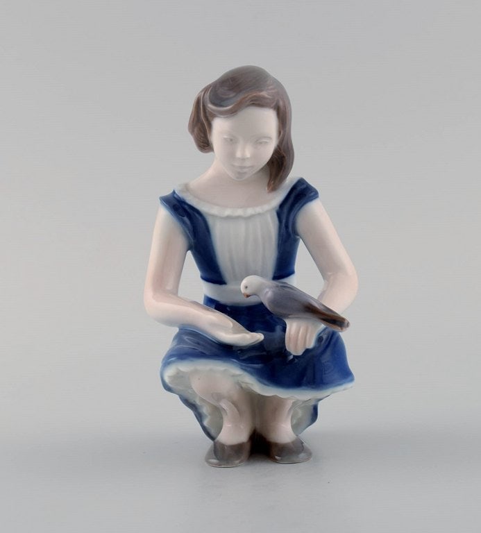 Bing & Grondahl porcelain figure. Girl with dove. Model number 2340. - 2