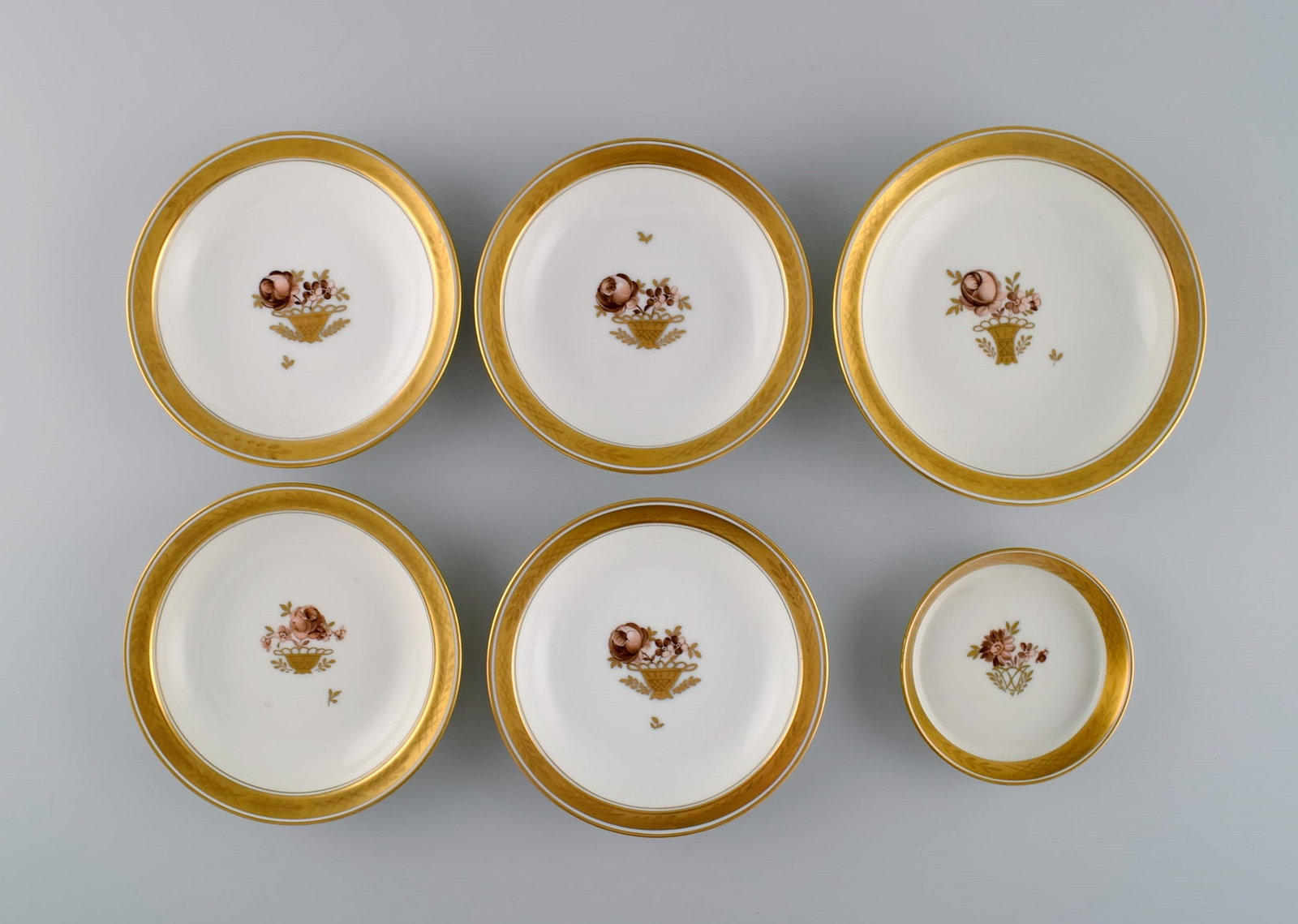 Six Royal Copenhagen Golden Basket porcelain bowls with flowers and gold decoration. 1960s.: Title: Six Royal Copenhagen Golden Basket porcelain bowls with flowers and gold decoration. 1960s. Description: Six Royal Copenhagen Golden Basket porcelain bowls with flowers and gold decoration. 196