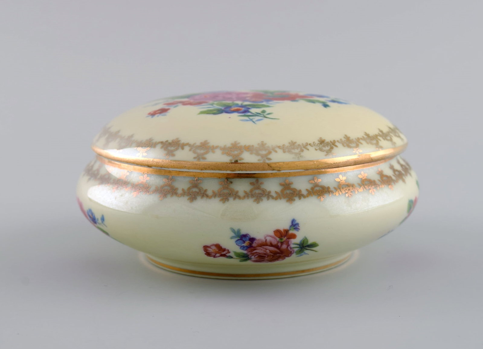 Limoges, France. Two perfume bottles, three vases and lidded box in hand-painted porcelain. Flowers - 8