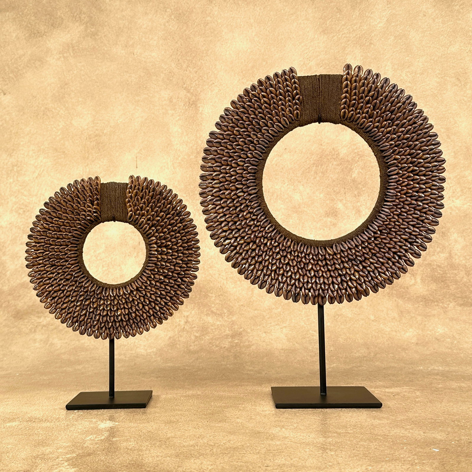 Pair of caramel coloured tolai necklaces with custom stands - 2
