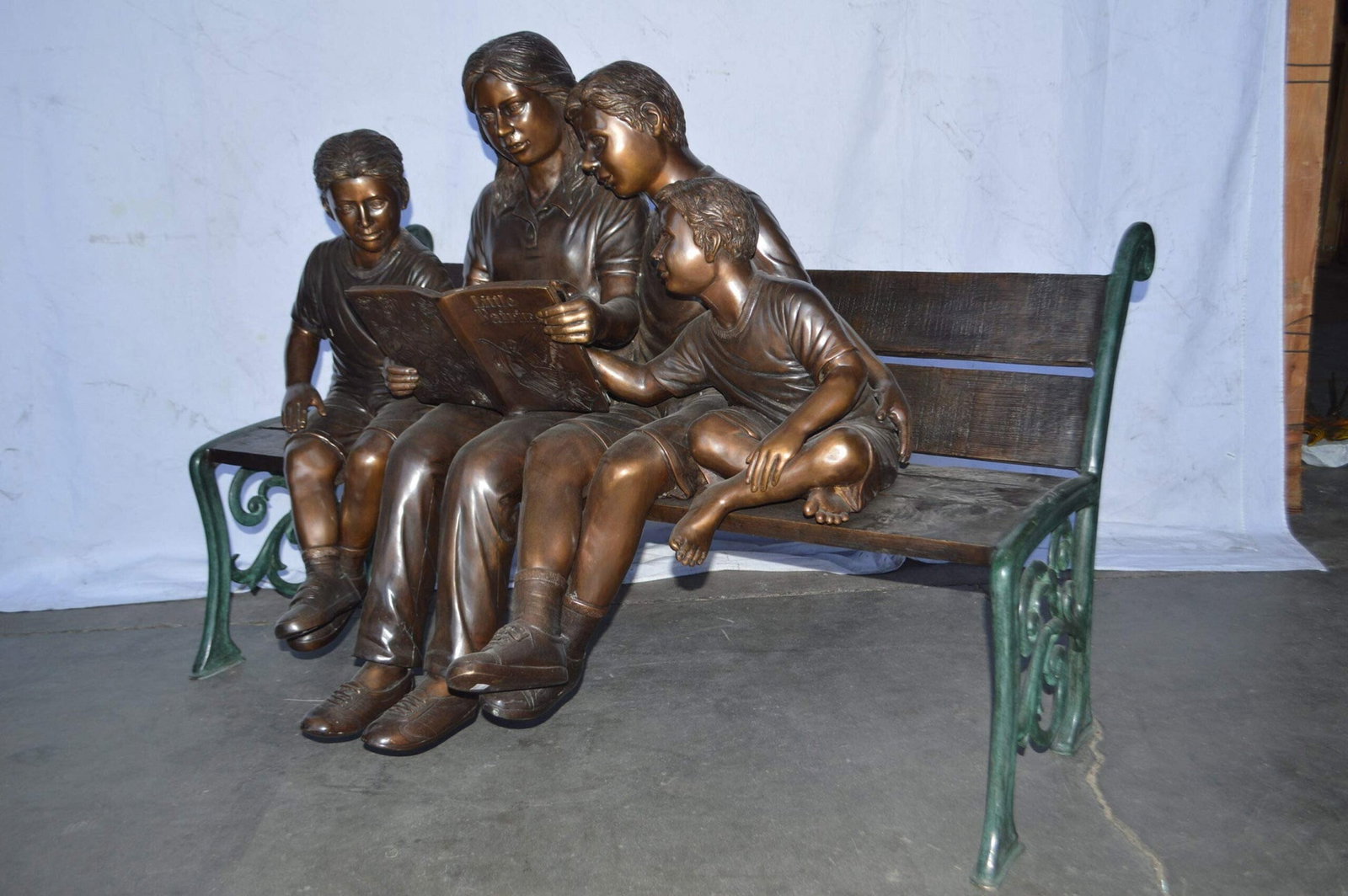 Mom and boys reading stories on bench bronze statue - Size: 53"L x 33"W x 39"H. - 7