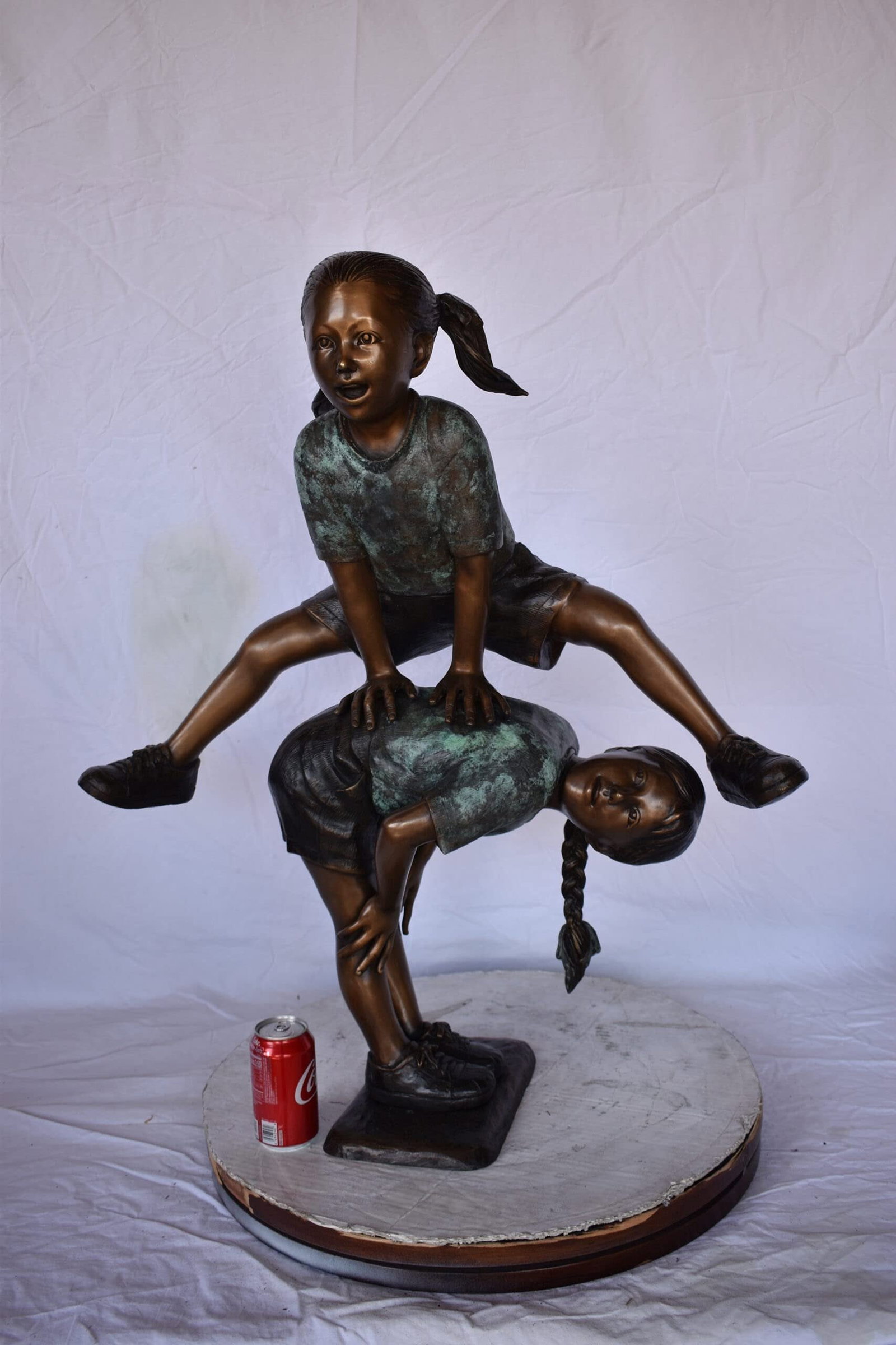 Two Girls Playing Leapfrog Jumping Bronze Statue - Size: 30"L x 14"W x 34"H. - 6