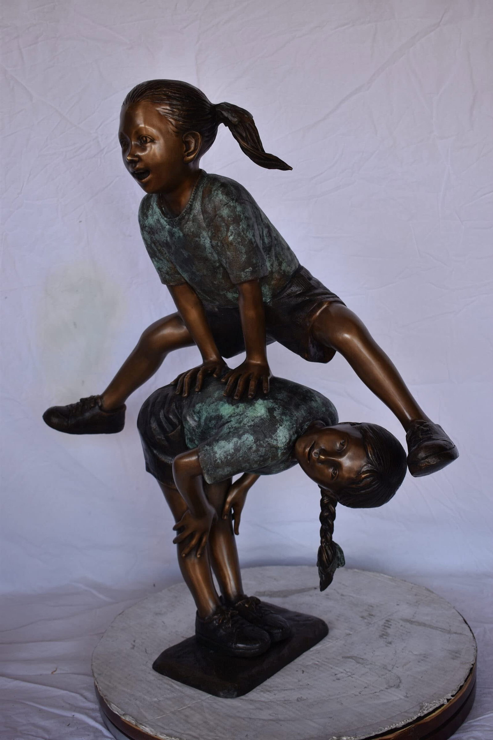 Two Girls Playing Leapfrog Jumping Bronze Statue - Size: 30"L x 14"W x 34"H. - 7
