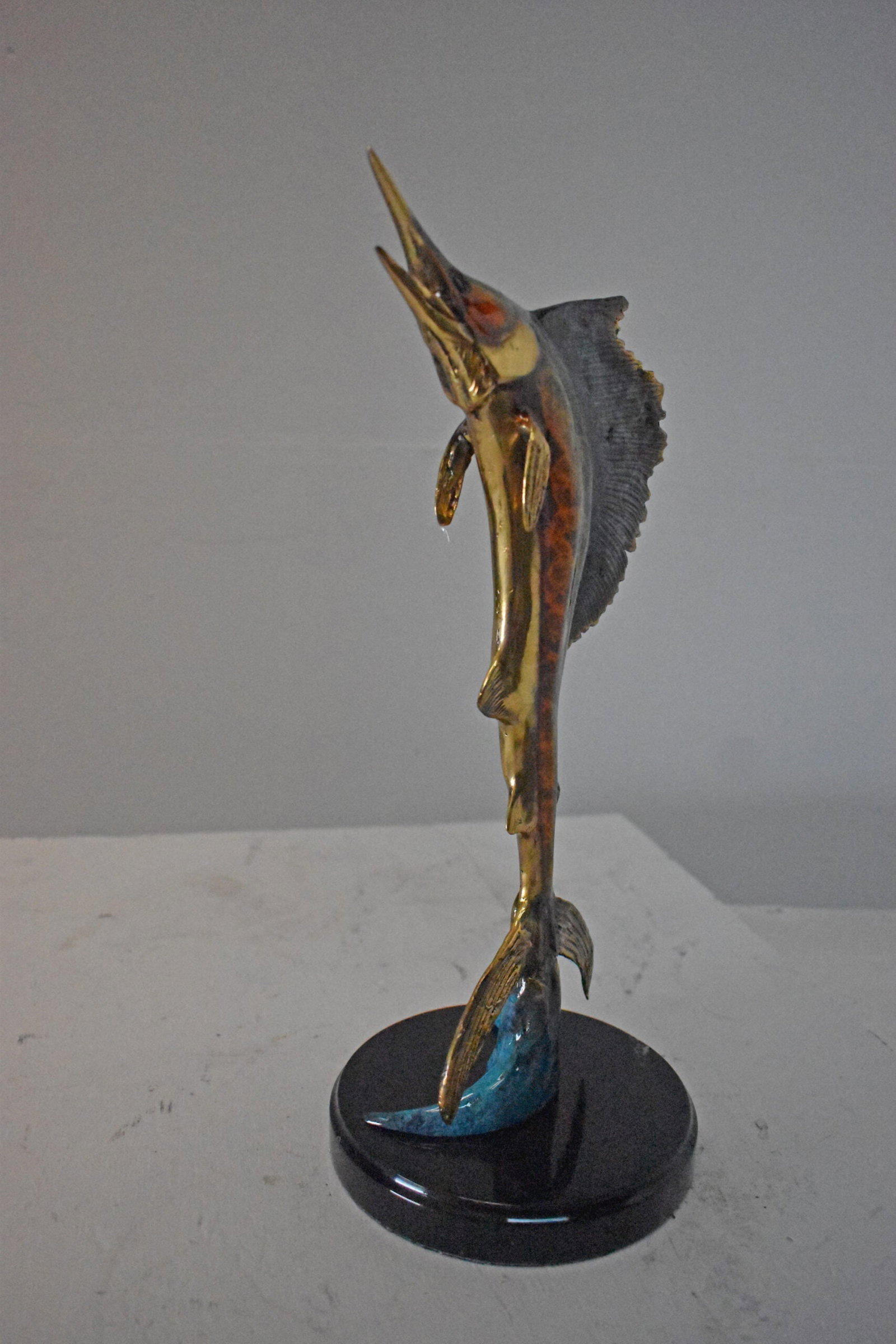 Single Sailfish Bronze Statue Mounted on Round Marble - Size: 6"L x 6"W x 15"H. - 5