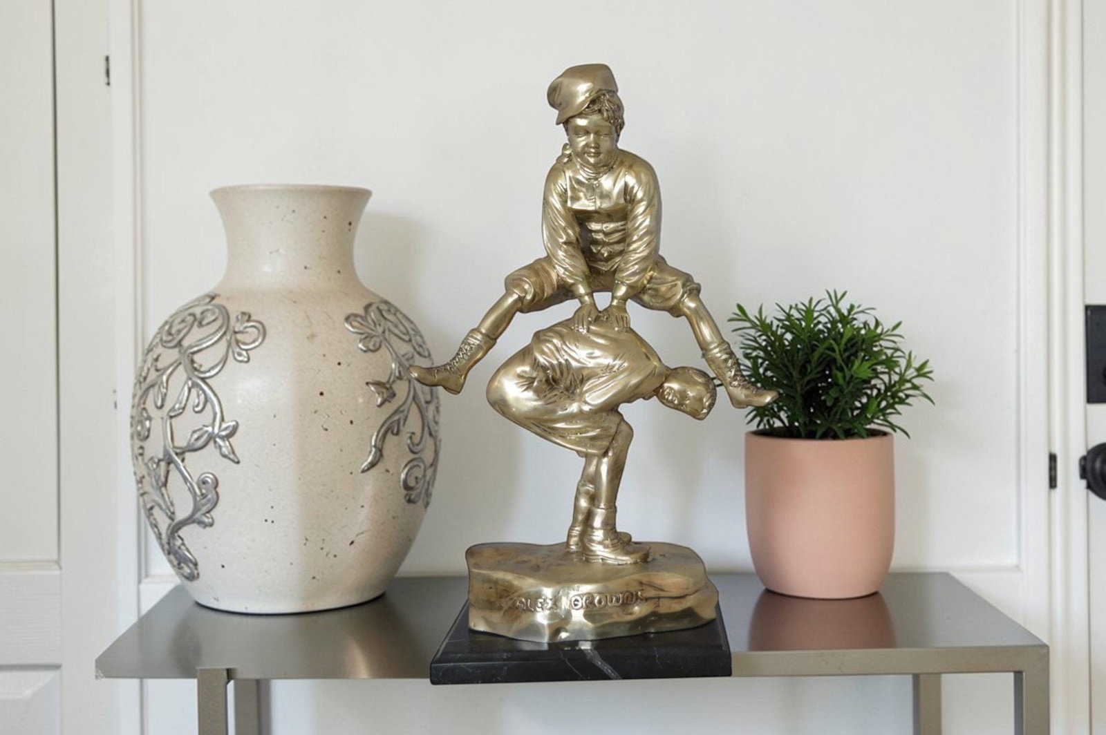 Leapfrog bronze statue silver finish - Size: 12"L x 7"W x 19"H. - 2