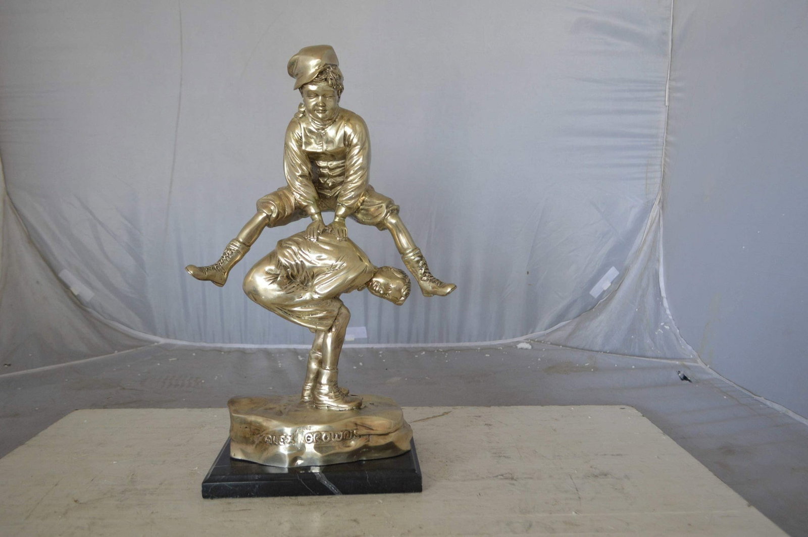 Leapfrog bronze statue silver finish - Size: 12"L x 7"W x 19"H. - 4