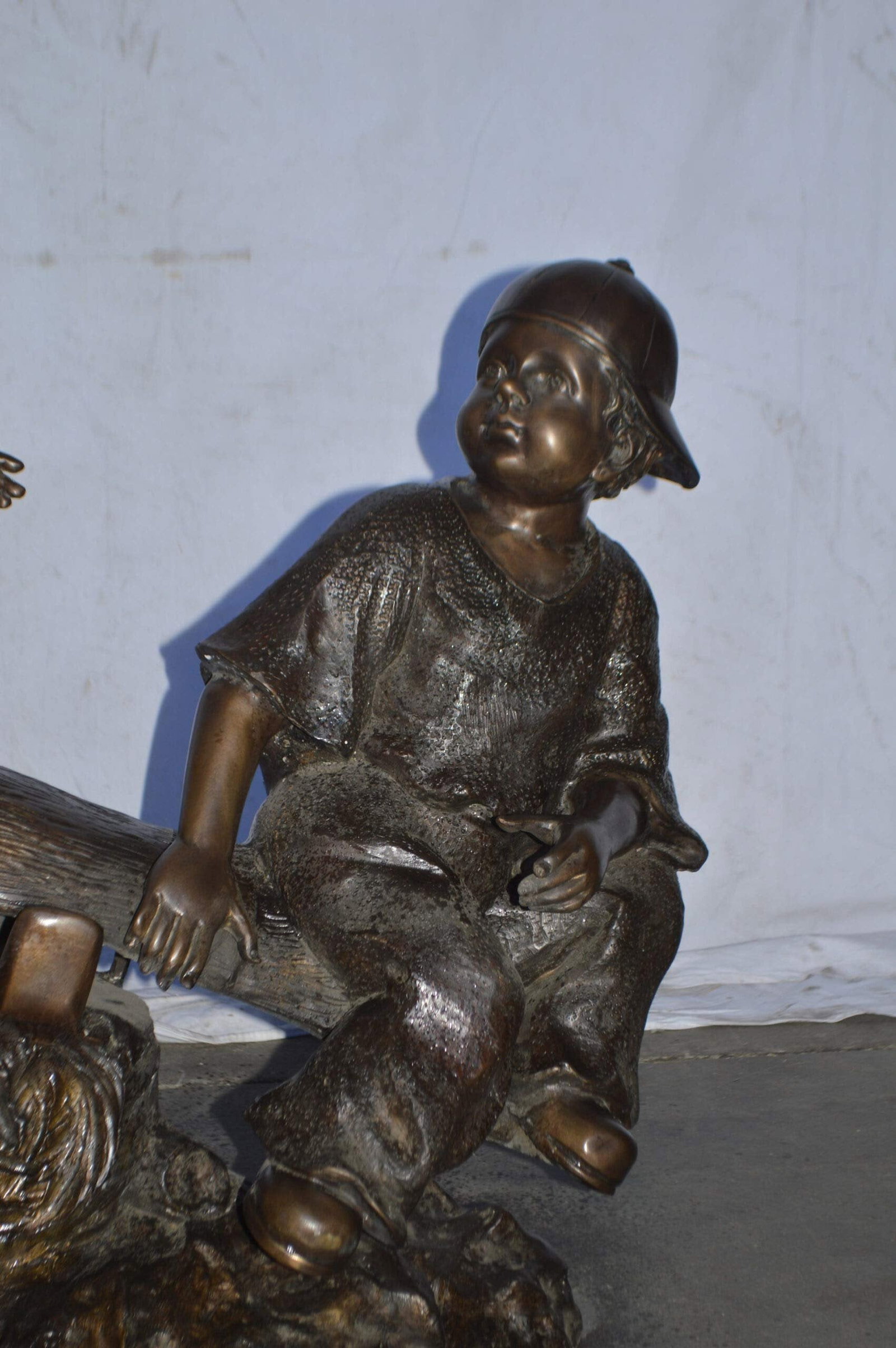 A Boy and a Girl Playing Seesaw Bronze Statue - Size: 17"L x 33"W x 36"H. - 5