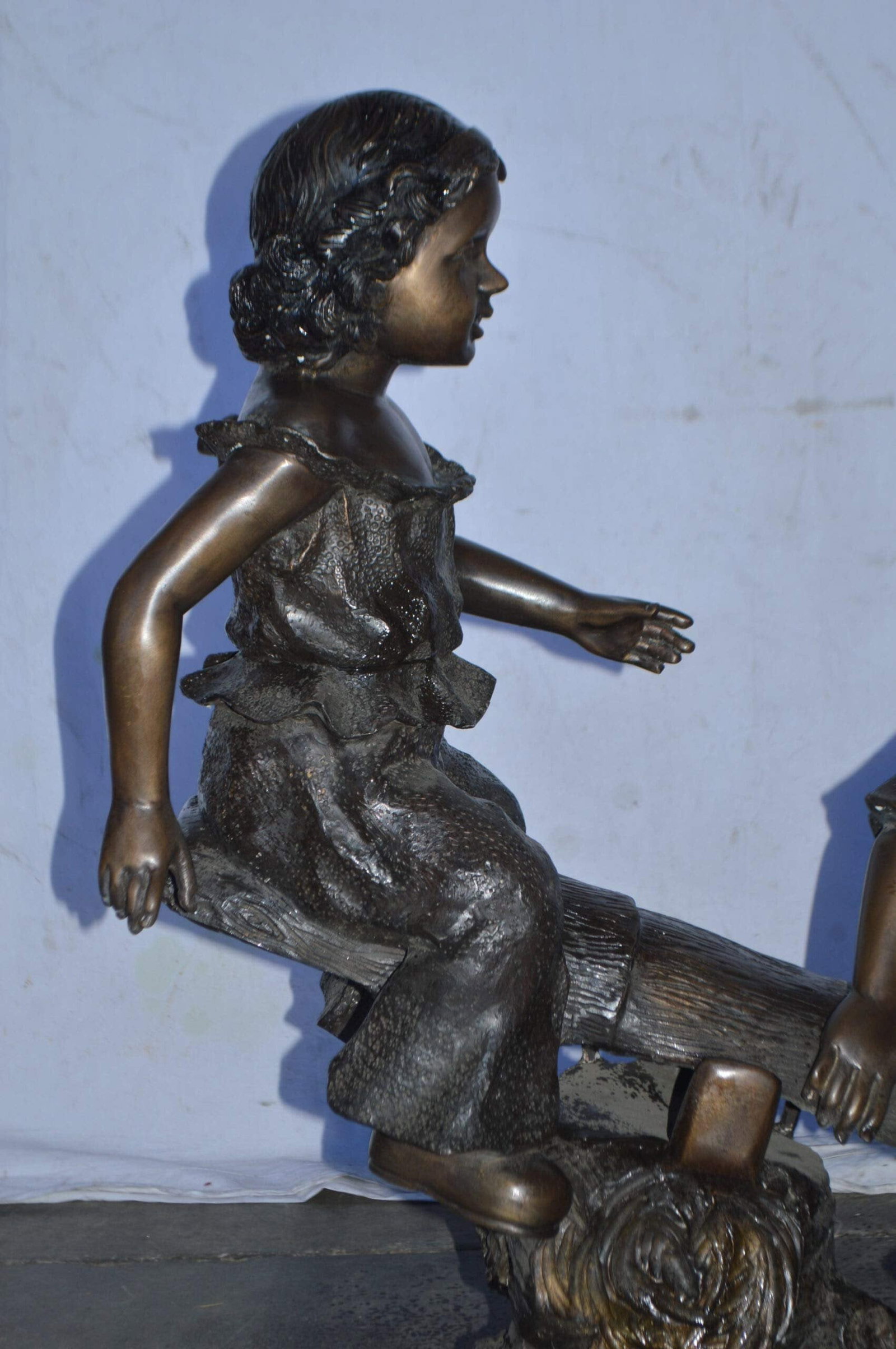 A Boy and a Girl Playing Seesaw Bronze Statue - Size: 17"L x 33"W x 36"H. - 6